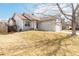 Exterior view of this home with a well-maintained lawn, complemented by mature trees at 5402 Sweet Grass Ct, Castle Rock, CO 80109