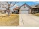 Charming home with a well-maintained lawn, a two-car garage, and beautiful brick accents at 5402 Sweet Grass Ct, Castle Rock, CO 80109