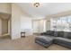 Inviting living room featuring neutral tones and a large window for natural light at 5402 Sweet Grass Ct, Castle Rock, CO 80109