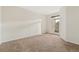 Spacious bedroom with light walls and a glass door to a balcony at 1535 S Florence Way # 407, Aurora, CO 80247