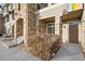 Townhouse exterior showcasing stone archway and well-maintained landscaping at 1535 S Florence Way # 407, Aurora, CO 80247