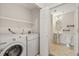 Combined laundry and bath area equipped with washer and dryer at 1535 S Florence Way # 407, Aurora, CO 80247