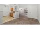 Open floorplan view of living area and kitchen with neutral color scheme at 1535 S Florence Way # 407, Aurora, CO 80247