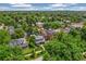Aerial view of a neighborhood with lush trees and well-maintained homes, showcasing a desirable community at 2324 S Columbine St, Denver, CO 80210