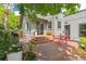 Backyard deck features red seating, slider access to the home and colorful plantings at 2324 S Columbine St, Denver, CO 80210