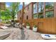 Spacious backyard with gravel, lounge chairs, planters, and grill, perfect for outdoor relaxation at 2324 S Columbine St, Denver, CO 80210
