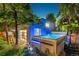 Backyard spa/shed with inviting hot tub, garden, and modern design at 2324 S Columbine St, Denver, CO 80210