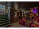 Entertainment basement with red leather recliners, a wooden staircase, and movie decor at 2324 S Columbine St, Denver, CO 80210