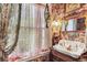 Detailed bathroom with decorative wallpaper, lace curtains, and vintage sink at 2324 S Columbine St, Denver, CO 80210