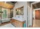 Bright bathroom with double sinks, vintage bathtub, luxurious shower, and natural light at 2324 S Columbine St, Denver, CO 80210