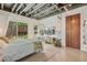 Modern bedroom with geometric patterns, concrete floors, and view of the backyard at 2324 S Columbine St, Denver, CO 80210