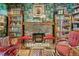 Unique living room with stone fireplace, built-in shelving, and playful red seating at 2324 S Columbine St, Denver, CO 80210