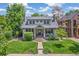 Charming home with a well-maintained front yard, mature trees, and a welcoming front porch at 2324 S Columbine St, Denver, CO 80210
