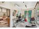 Converted garage features seating area, a glass table, and modern decor at 2324 S Columbine St, Denver, CO 80210