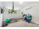 Home gym with modern equipment, tv, padded floor and natural light at 2324 S Columbine St, Denver, CO 80210