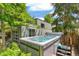 This backyard features a hot tub for relaxing and enjoying the outdoor space at 2324 S Columbine St, Denver, CO 80210