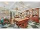 Spacious kitchen with checkered floor, large central island, and wood cabinets in a vintage design at 2324 S Columbine St, Denver, CO 80210