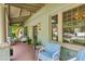 Inviting covered porch with comfortable seating, perfect for relaxing and enjoying the outdoors at 2324 S Columbine St, Denver, CO 80210
