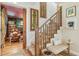 Charming staircase featuring custom runner and nearby living room with eclectic decor at 2324 S Columbine St, Denver, CO 80210
