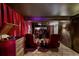 Luxurious theater room with red velvet curtains and comfortable seating at 2324 S Columbine St, Denver, CO 80210