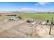Aerial view of a vast farm property with multiple buildings and surrounding fields at 8260 County Road 39, Fort Lupton, CO 80621