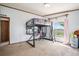 This bedroom offers neutral tones and a unique bed and lovely view out the window at 8260 County Road 39, Fort Lupton, CO 80621