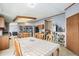 Open dining area with kitchen view and backyard views at 8260 County Road 39, Fort Lupton, CO 80621