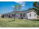 Charming single-story home featuring a well-maintained lawn and classic vinyl siding at 8260 County Road 39, Fort Lupton, CO 80621
