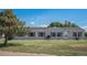 Single-story home featuring a well-maintained lawn and classic vinyl siding at 8260 County Road 39, Fort Lupton, CO 80621