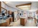 Well-lit kitchen featuring an island and a dining area with a stainless steel refrigerator at 8260 County Road 39, Fort Lupton, CO 80621