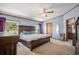 Spacious main bedroom featuring a ceiling fan and two large windows at 8260 County Road 39, Fort Lupton, CO 80621