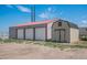 Spacious outbuilding featuring three garage doors and an additional separate storage unit at 8260 County Road 39, Fort Lupton, CO 80621