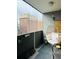 Cozy balcony featuring a stylish egg chair and views of neighboring buildings at 909 N Logan St # 6D, Denver, CO 80203