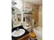 Well-lit bathroom with modern vanity, shower/tub combo, and stylish decor at 909 N Logan St # 6D, Denver, CO 80203
