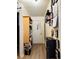 Hallway offers ample storage with custom shelving and unique wall decor at 909 N Logan St # 6D, Denver, CO 80203