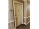 Apartment door in a well-maintained hallway with neutral colors and classic trim details at 909 N Logan St # 6D, Denver, CO 80203