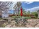 Relax in the shade with the outdoor dining set in this spacious backyard setting at 3600 Olive St, Denver, CO 80207