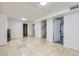 Spacious basement area featuring tile floors and easy access to multiple rooms at 3600 Olive St, Denver, CO 80207