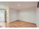 Basement featuring hardwood floors and open space at 3600 Olive St, Denver, CO 80207