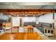 Finished basement with a large seating area, wood beams, recessed lighting, and a cozy, inviting atmosphere at 169 Emerald St, Broomfield, CO 80020