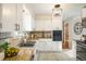 Clean kitchen with white cabinets, granite counters, and stainless steel sink at 169 Emerald St, Broomfield, CO 80020
