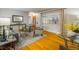 Bright living area featuring hardwood floors, decorative mirror, and modern accents at 169 Emerald St, Broomfield, CO 80020