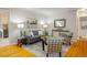 Cozy living room featuring hardwood floors, gray sofa, and stylish decor at 169 Emerald St, Broomfield, CO 80020