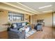 Comfortable covered patio with brick walls, skylights, and stylish seating area at 169 Emerald St, Broomfield, CO 80020