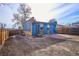 Backyard with a modern, blue studio and a privacy fence at 1937 Jay St, Lakewood, CO 80214