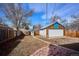 Spacious backyard with detached garage and patio area for entertaining at 1937 Jay St, Lakewood, CO 80214