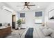 Cozy bedroom featuring a ceiling fan, neutral tones, and a comfortable bed setting at 1937 Jay St, Lakewood, CO 80214