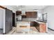 Modern kitchen features stainless steel appliances, custom cabinets, and a functional kitchen island at 1937 Jay St, Lakewood, CO 80214