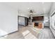 Spacious kitchen with stainless steel appliances, center island, and stylish dark wood cabinets at 1937 Jay St, Lakewood, CO 80214