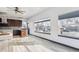 Open kitchen featuring dark wood cabinets, stainless steel appliances, and abundant natural light at 1937 Jay St, Lakewood, CO 80214